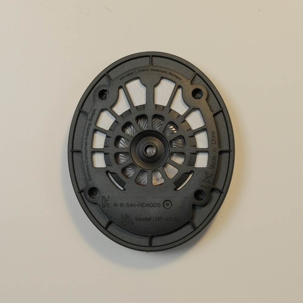 speaker module removed from donor headphones before being trimmed down