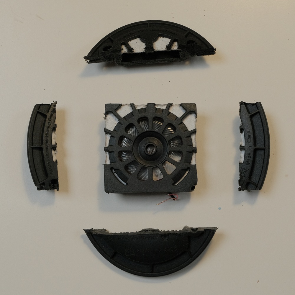 speaker module removed from donor headphones after being trimmed down